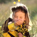 Child in a field sneezing - keep pests away from your home with Arrow Exterminating Company in NY