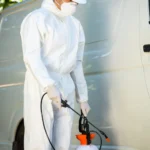 A pest control technician with pest control equipment and a van - keep pests away from your home with Arrow Exterminating Company in NY