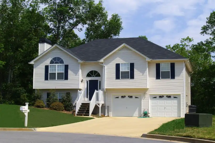 Suburban home with white wooden exterior - keep termites away from your home with Arrow Exterminating Company in NY