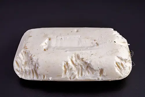 Gnaw marks from a rodent on a bar of soap