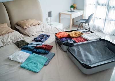 clothing on a bed to be inspected for bed bugs