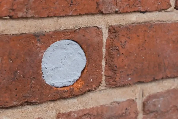 Rodent Flexi Armor applied to a hole in a brick wall