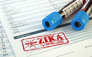 Blood vials and blood test paperwork stamped Zika Virus.